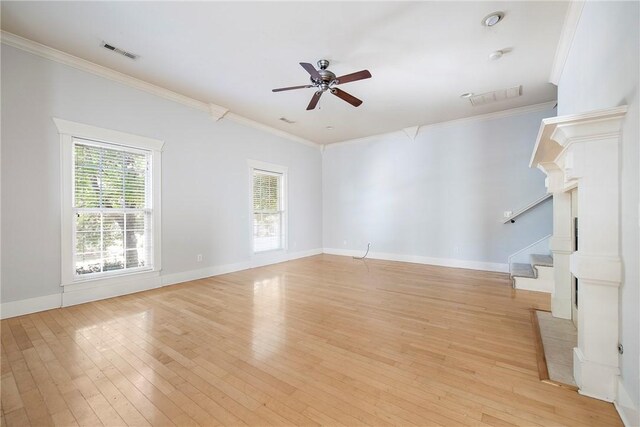 3706 Cherokee Rd, Rogers, AR 72758 - unfurnished living room with stairs, visible vents, and light wood-style floors
