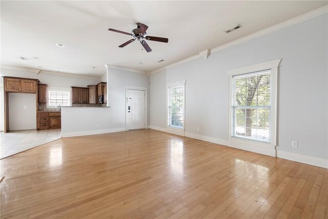 3706 Cherokee Rd, Rogers, AR 72758 - unfurnished living room featuring ceiling fan, a sink, baseboards, light wood finished floors, and crown molding
