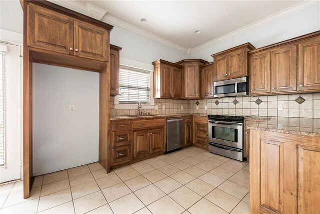 3706 Cherokee Rd, Rogers, AR 72758 - kitchen featuring light tile patterned floors, decorative backsplash, appliances with stainless steel finishes, brown cabinets, and a sink