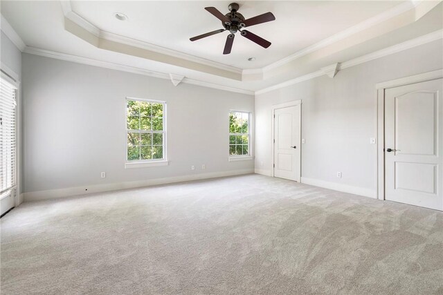 3706 Cherokee Rd, Rogers, AR 72758 - carpeted empty room featuring baseboards, ceiling fan, a tray ceiling, and crown molding
