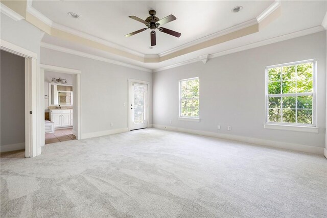 3706 Cherokee Rd, Rogers, AR 72758 - unfurnished bedroom with carpet floors, a tray ceiling, ornamental molding, ensuite bath, and baseboards