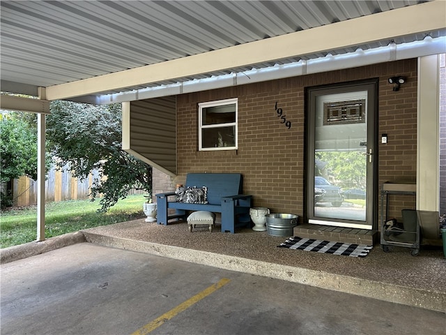 entrance to property featuring a patio area