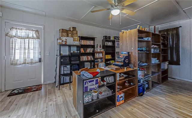 office with hardwood / wood-style floors and ceiling fan