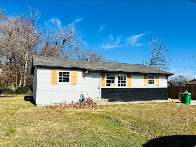 ranch-style home with a front lawn