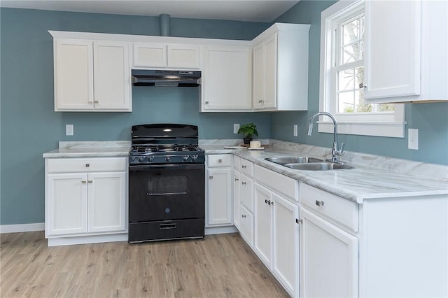 kitchen with sink, light hardwood / wood-style flooring, black gas stove, light stone countertops, and white cabinets