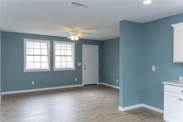 interior space featuring light hardwood / wood-style flooring and ceiling fan