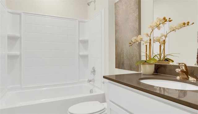 full bathroom with bathtub / shower combination, vanity, and toilet