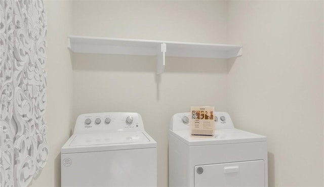 laundry area with washing machine and dryer