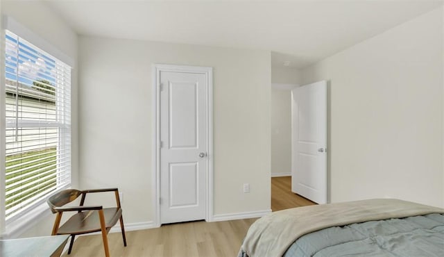 bedroom with light hardwood / wood-style floors