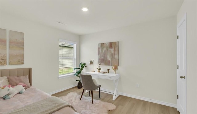 bedroom with light hardwood / wood-style floors