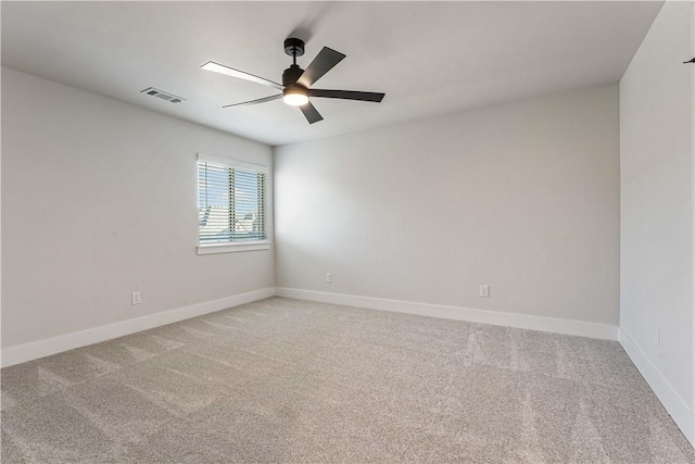 spare room with ceiling fan and carpet floors