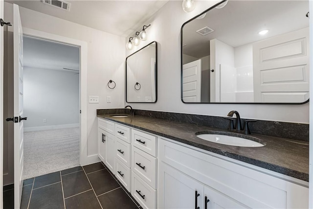 bathroom featuring tile patterned floors and vanity