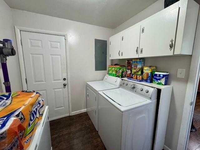 laundry room with washer and dryer, dark hardwood / wood-style floors, cabinets, and electric panel