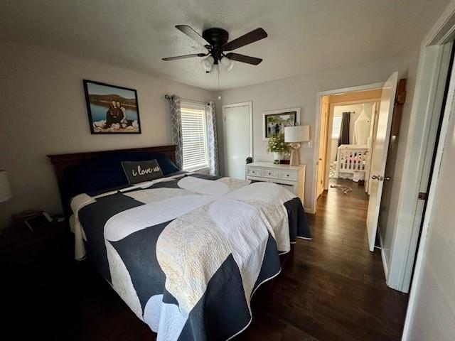 bedroom featuring ceiling fan and dark hardwood / wood-style flooring