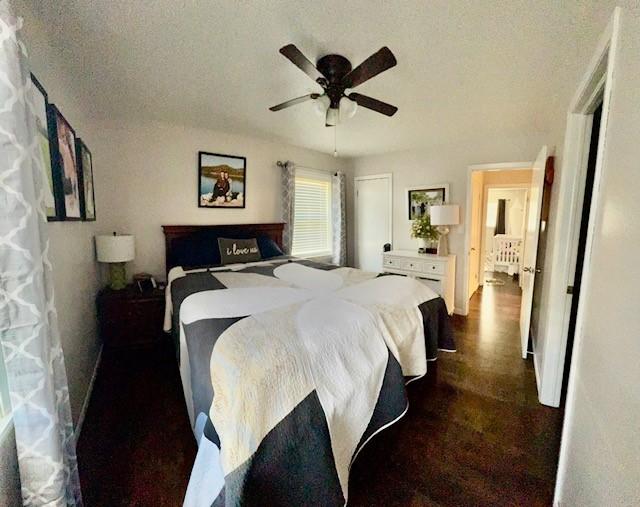 bedroom with a textured ceiling and ceiling fan