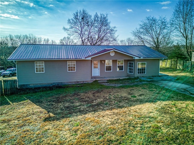 single story home with a front lawn