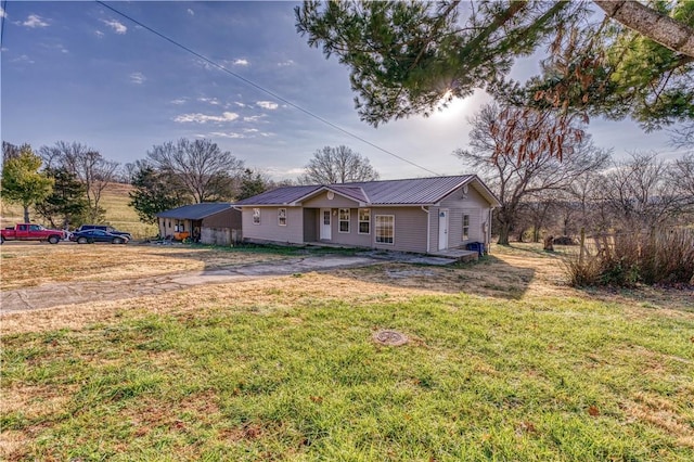 ranch-style home featuring a front yard