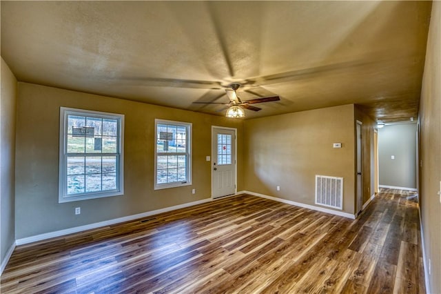 foyer entrance with dark hardwood / wood-style floors and ceiling fan