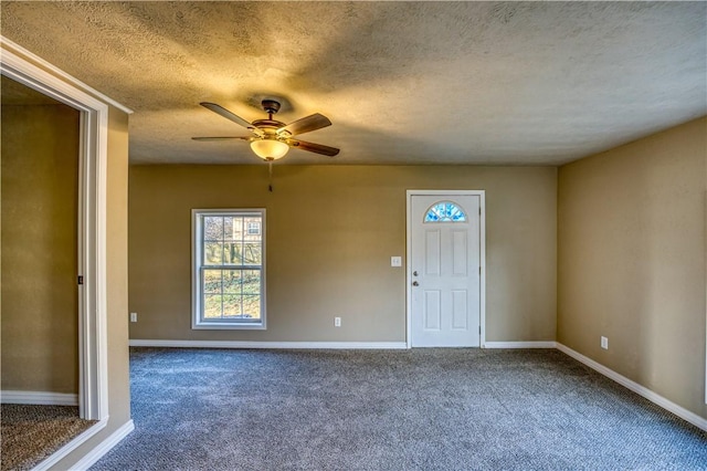 interior space featuring carpet flooring and a textured ceiling