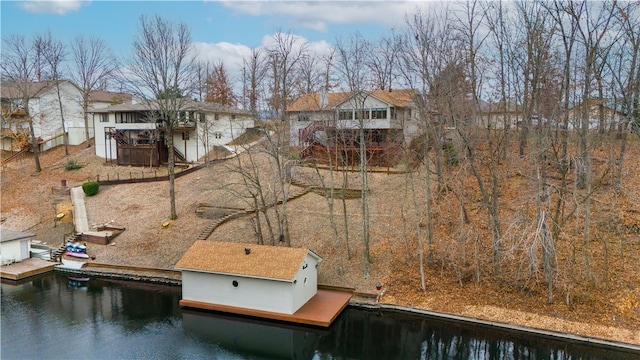 rear view of property featuring a water view