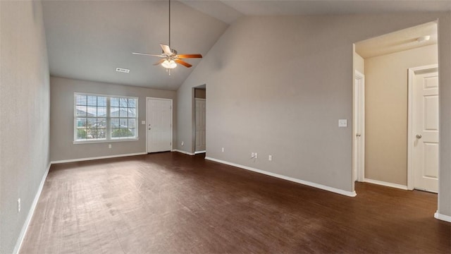 spare room featuring dark wood-type flooring, ceiling fan, and lofted ceiling