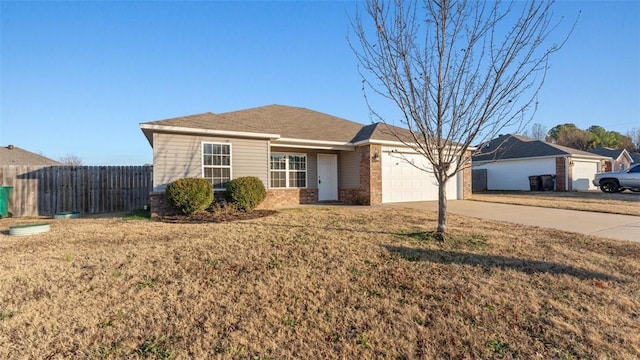 single story home featuring a front lawn and a garage