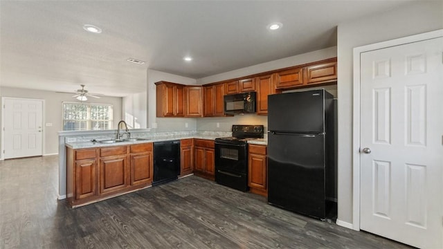 kitchen featuring dark hardwood / wood-style flooring, sink, ceiling fan, and black appliances