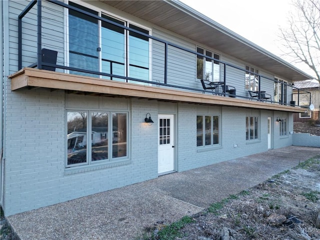 rear view of property featuring a patio area