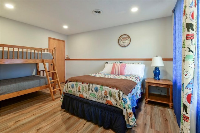 bedroom with hardwood / wood-style flooring