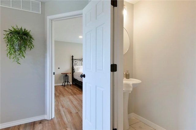 bathroom featuring wood-type flooring