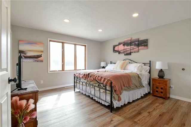 bedroom with wood-type flooring