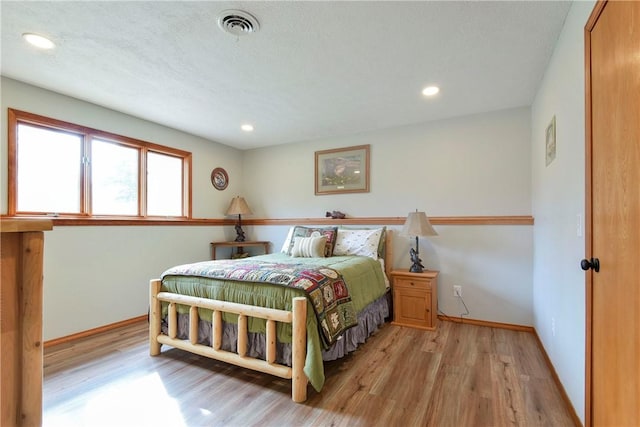 bedroom with light hardwood / wood-style floors