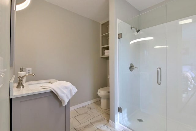 bathroom with vanity, toilet, and walk in shower