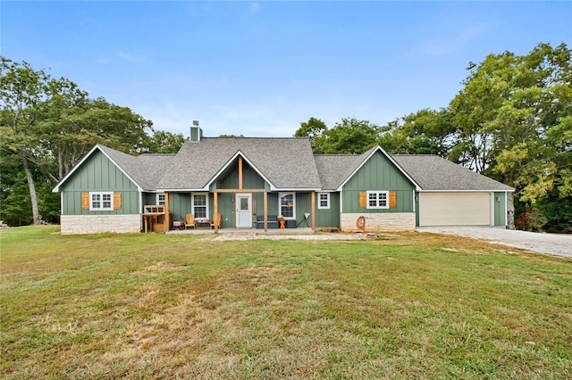 view of front of house with a garage and a front lawn