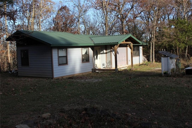 exterior space with a shed