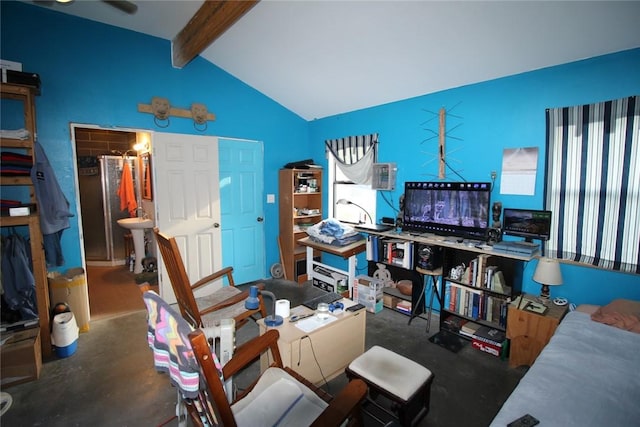 interior space with ceiling fan and lofted ceiling with beams