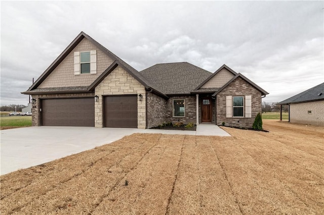 craftsman-style home featuring a front lawn and a garage