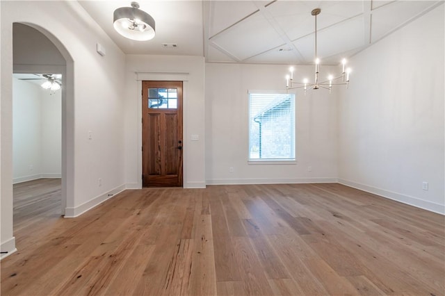 256 Fiori St, Springdale, AR 72762 - entrance foyer with light wood finished floors, arched walkways, and a chandelier