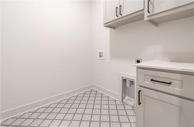 laundry room featuring washer hookup, cabinets, and hookup for an electric dryer