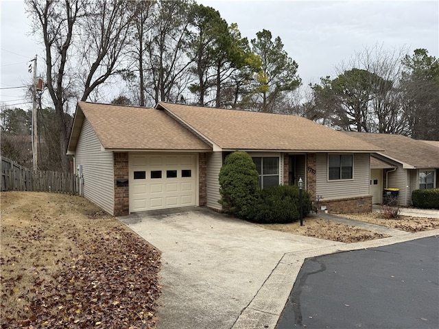 single story home with a garage