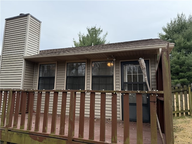 entrance to property with a wooden deck