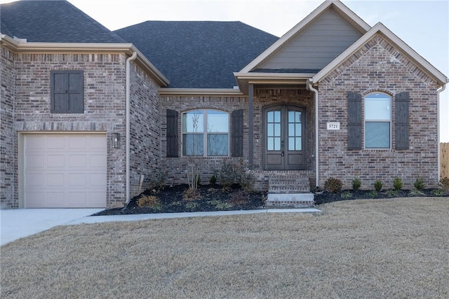 view of front facade with french doors and a garage