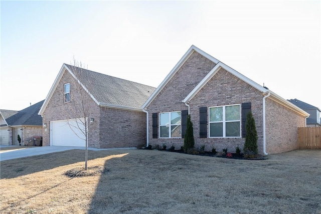 view of front of home featuring a garage and a front yard