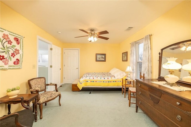 carpeted bedroom with ceiling fan