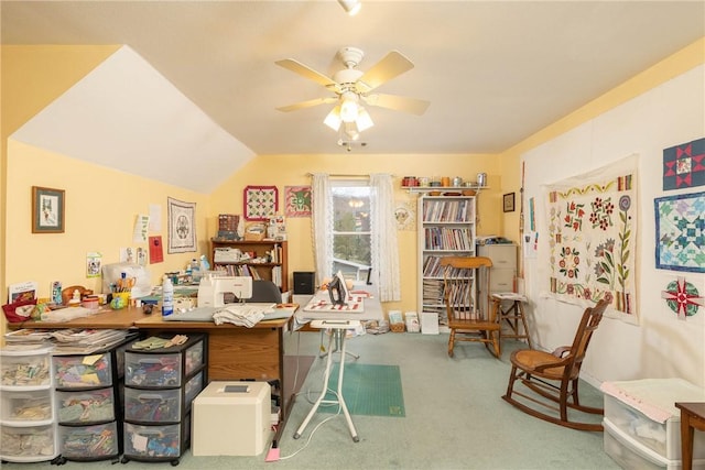 carpeted office space with ceiling fan and lofted ceiling