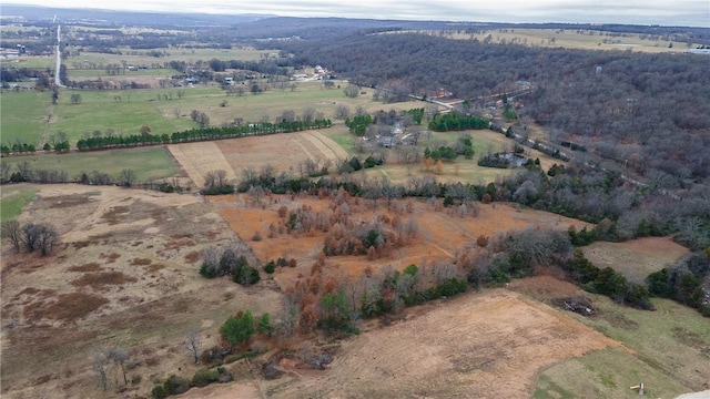 birds eye view of property with a rural view