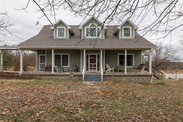 new england style home featuring covered porch