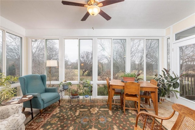 sunroom / solarium with a wealth of natural light and ceiling fan