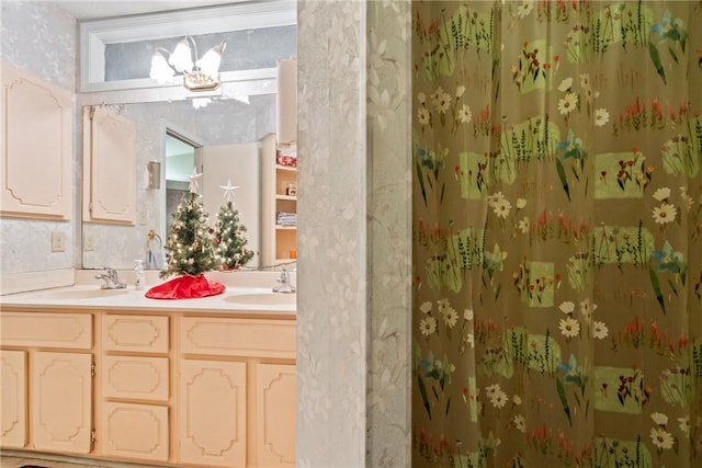 bathroom with a shower and vanity