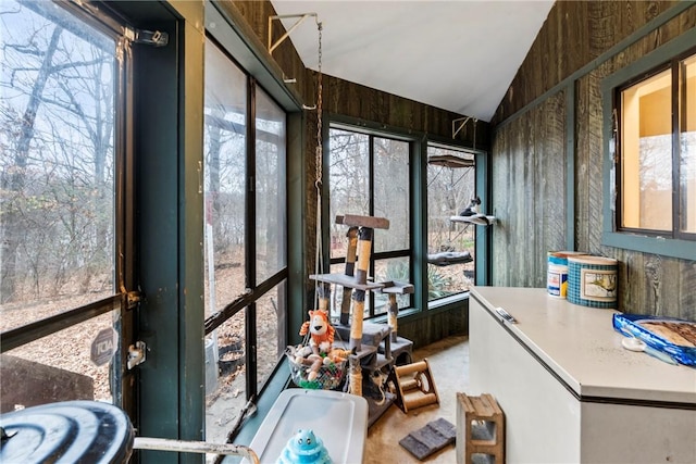 sunroom / solarium with vaulted ceiling